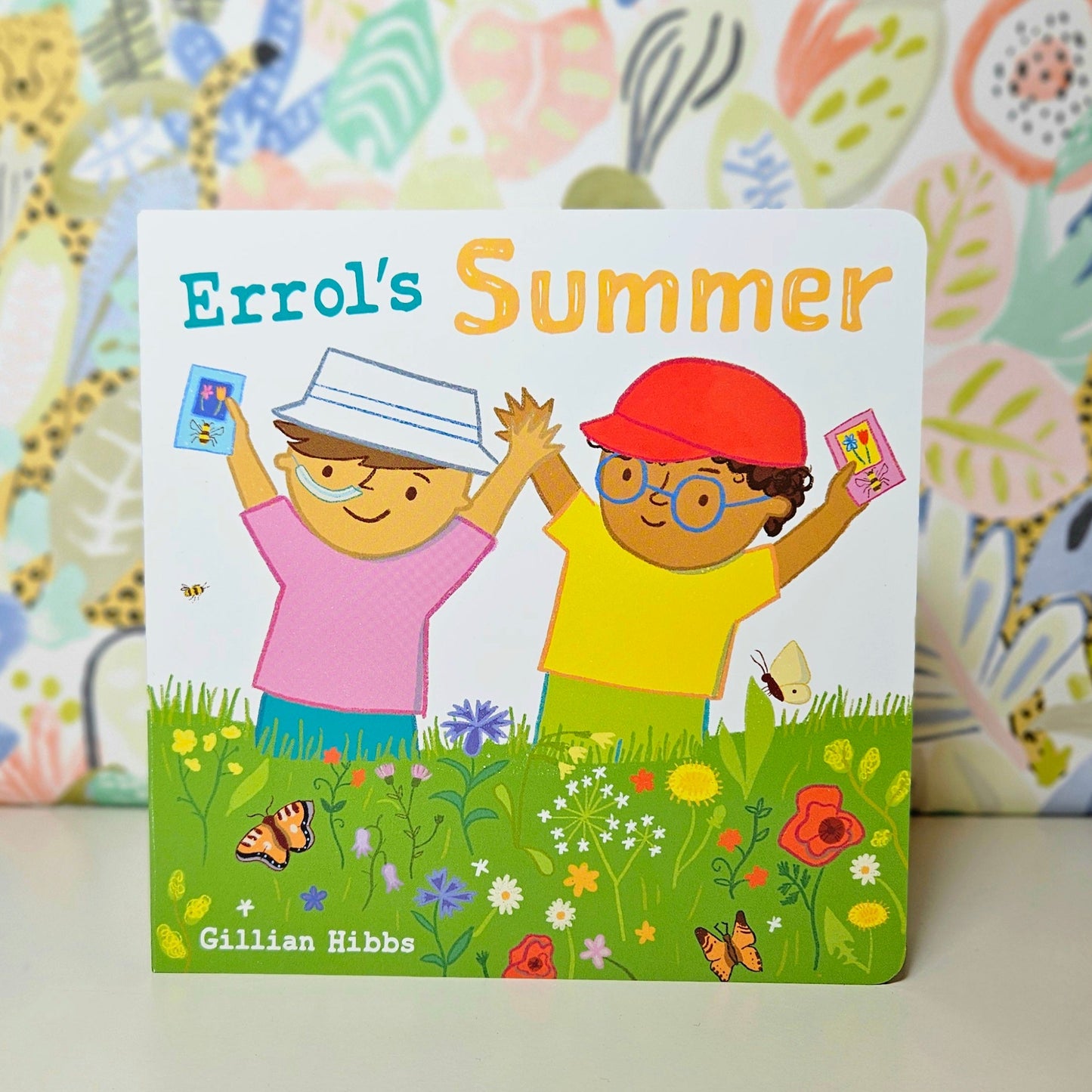 Children's book titled 'Errol's Summer' with colorful cover featuring two children in a garden.